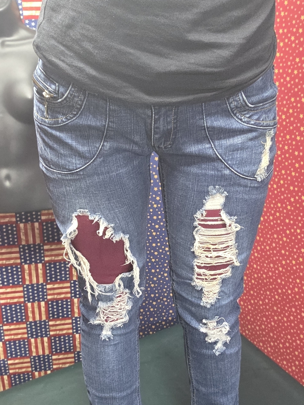 **Women’s Skinny Distressed Blue Jeans with Burgundy Patch Details**